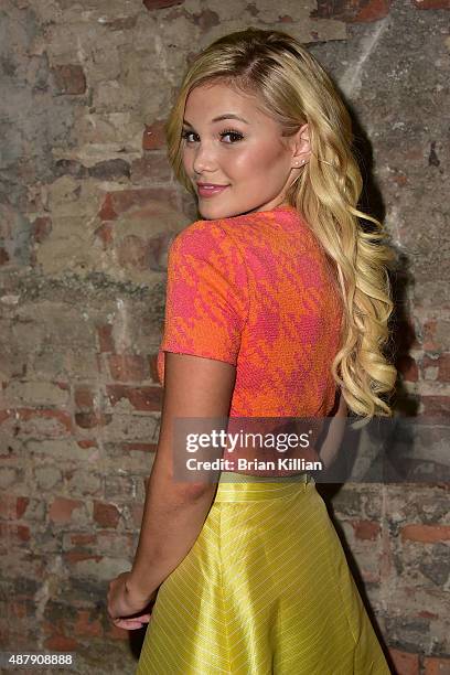 Olivia Holt poses backstage just before the start of the Christian Siriano show during Spring 2016 New York Fashion Week at ArtBeam on September 12,...