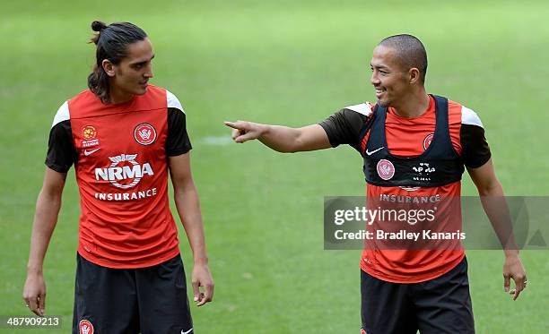 Jerome Polenz and Shinji Ono chat during a Western Sydney Wanderers A-League training session at Suncorp Stadium on May 3, 2014 in Brisbane,...