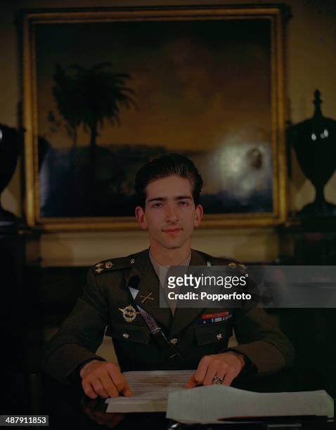 Portrait of King Peter II of Yugoslavia in military uniform at his desk during World War Two, May 1943.