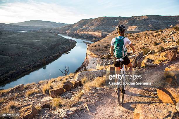 biking a scenic trail. - fruita colorado stock pictures, royalty-free photos & images