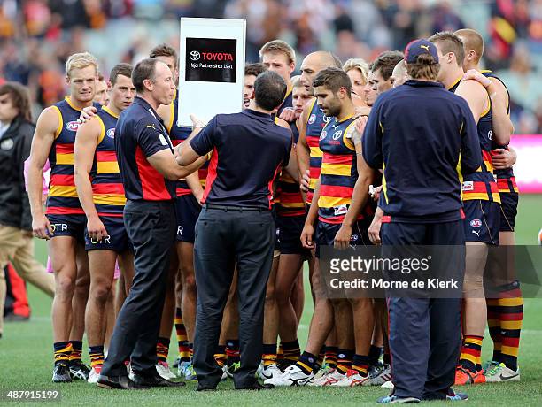 Brenton Sanderson of the Crows speaks to his team during the round seven AFL match between the Adelaide Crows and the Melbourne Demons at Adelaide...