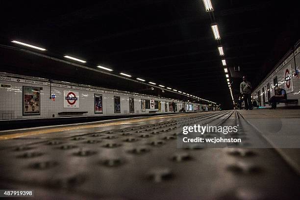 london underground platform - london underground poster stock pictures, royalty-free photos & images