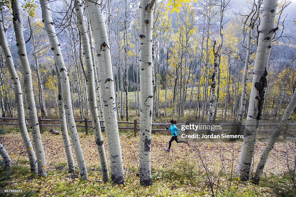 A female jogging in the winter.