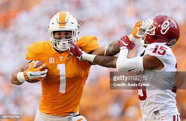 Jalen Hurd of the Tennessee Volunteers runs with the ball while defended by Zack Sanchez of the Oklahoma Sooners during the game at Neyland Stadium...