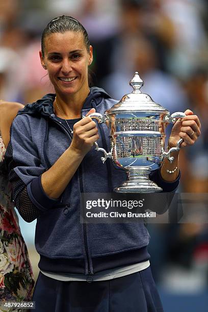 Flavia Pennetta of Italy celebrates with the winner's trophy after defeating Roberta Vinci of Italy during their Women's Singles Final match on Day...