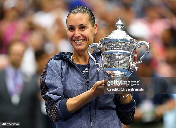 Flavia Pennetta of Italy celebrates with the winner's trophy after defeating Roberta Vinci of Italy during their Women's Singles Final match on Day...