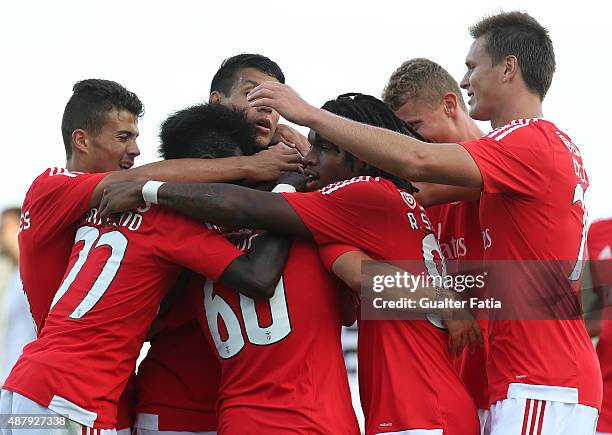 Benfica II's defender Pedro Rebocho celebrates with teammates after scoring a goal during the Primeira Liga match between SL Benfiva II and Academica...