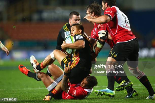 Tim Nanai-Williams of the Chiefs is tackled by Elton Jantjies of the Lions during the round 12 Super Rugby match between the Chiefs and the Lions at...