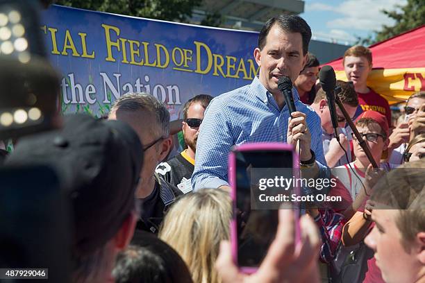 Republican presidential candidate, Wisconsin Gov. Scott Walker speaks to fans tailgating outside Jack Trice Stadium before the start of the Iowa...