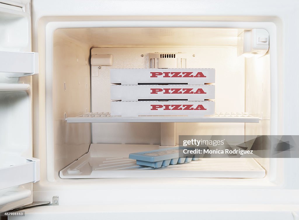 Frozen Pizza inside Home Freezer