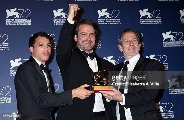 Luis Silva, director Lorenzo Vigas and Alfredo Castro pose with the Golden Lion Award for Best Film for the movie 'From Afar' as they attends attend...