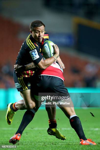 Tim Nanai-Williams of the Chiefs is tackled by Courtnall Skosan of the Lions during the round 12 Super Rugby match between the Chiefs and the Lions...