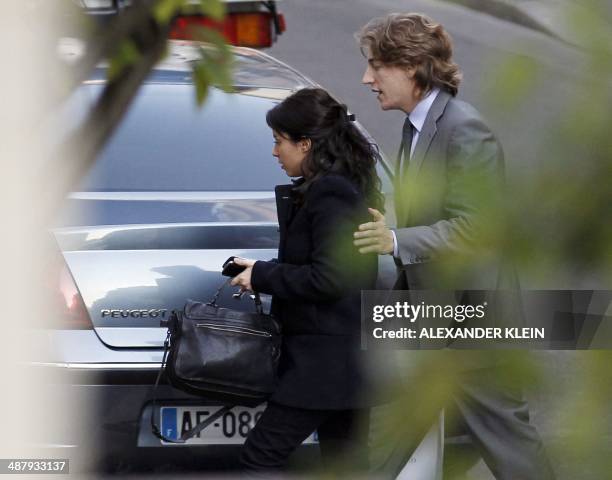 Jean Sarkozy , one of French President's sons , arrives by car with his wife, Jessica Sebaoun-Darty, at La Muette clinic on October 21, 2011....