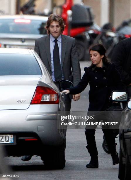 Jean Sarkozy , one of French President's son , arrives by car with his wife, Jessica Sebaoun-Darty, at La Muette clinic on October 21, 2011. France's...