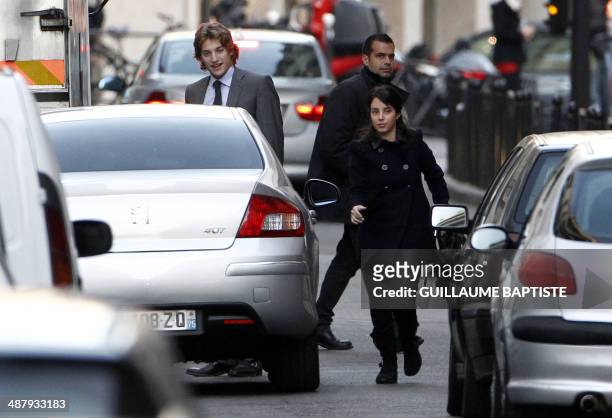 Jean Sarkozy , one of French President's son , arrives by car with his wife, Jessica Sebaoun-Darty, at La Muette clinic on October 21, 2011. France's...