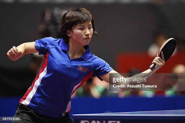 Jong Kim of North Korea plays a backhand against Yuling Zhu of China during day six of the 2014 World Team Table Tennis Championships at Yoyogi...
