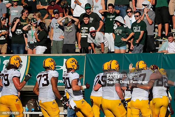 The Minnesota Golden Gophers celebrates touchdown by KJ Maye of the Minnesota Golden Gophers as the Colorado State Rams fans look on and the Golden...