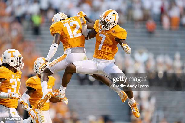 Cameron Sutton and Emmanuel Moseley of the Tennessee Volunteers celebrate after Moseley broke up a pass against the Oklahoma Sooners during the game...