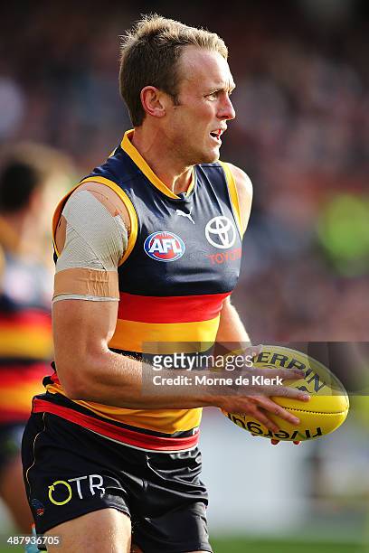 Brent Reilly of the Crows runs with the ball during the round seven AFL match between the Adelaide Crows and the Melbourne Demons at Adelaide Oval on...