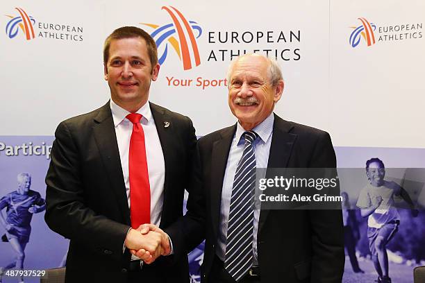 Veselin Jevrosimovic , president of Athletics Federation of Serbia, shakes hands with Hansjoerg Wirz, President of European Athletics, after signing...