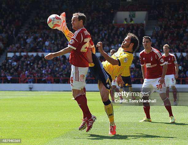 David Vaughan of Nottingham Forest tackled by Inigo Calderon of Brighton & Hove Albion during the Sky Bet Championship match between Nottingham...