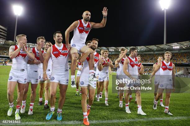 Rhyce Shaw of the Swans is chaired from the field after playing his 200th game during the round seven AFL match between the Brisbane Lions and the...