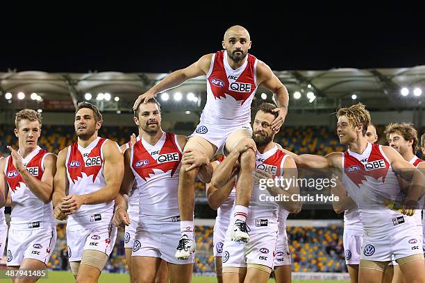 Rhyce Shaw of the Swans is chaired from the field after playing his 200th game during the round seven AFL match between the Brisbane Lions and the...