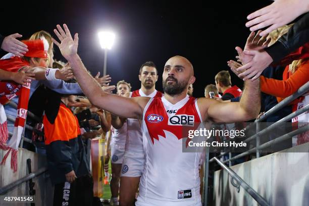 Rhyce Shaw of the Swans leaves the field after playing his 200th game and winning the round seven AFL match between the Brisbane Lions and the Sydney...