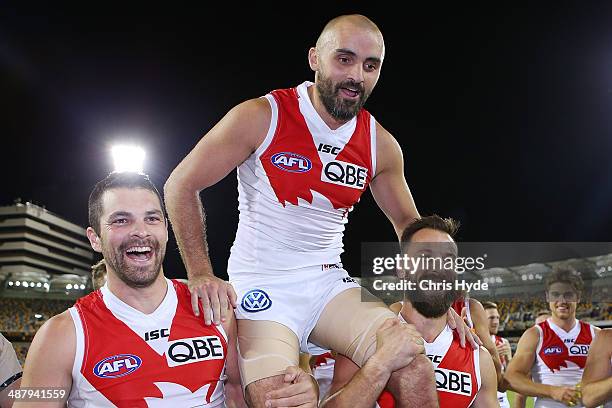 Rhyce Shaw of the Swans is chaired from the field after playing his 200th game during the round seven AFL match between the Brisbane Lions and the...