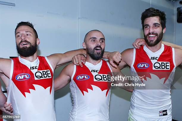 Nick Malceski, Rhyce Shaw and Tom Derickx sing the team song during the round seven AFL match between the Brisbane Lions and the Sydney Swans at The...