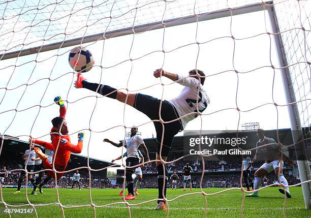 Goalkeeper Hugo Lloris of Spurs and Gylfi Sigurdsson of Spurs fail to stop the ball going into the net as teamateHarry Kane of Spurs scores an own...