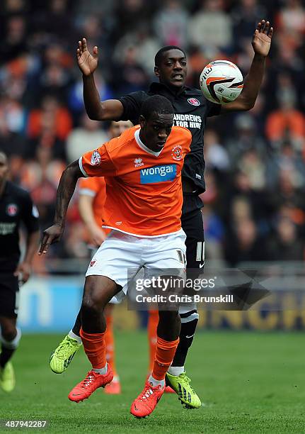 Isaiah Osbourne of Blackpool in action with Marvin Sordell of Charlton Athletic during the Sky Bet Championship match between Blackpool and Charlton...