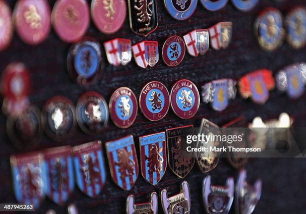 Team badges on sale outside the Aston Villa ground before the Barclays Premier League match between Aston Villa and Hull City at Villa Park on May 3,...