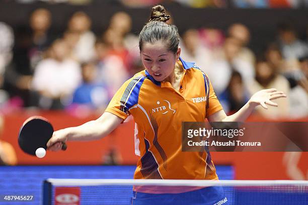 Jie Li of Netherlands plays a forehand against Yuka Ishigaki of Japan during day six of the 2014 World Team Table Tennis Championships at Yoyogi...