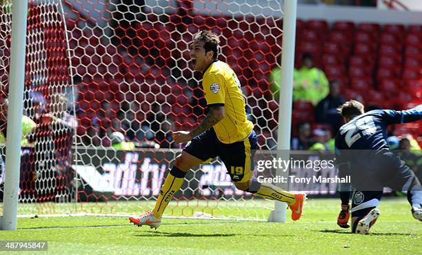 Leonardo Ulloa of Brighton & Hove Albion celebrates scoring the winning goal during the Sky Bet Championship match between Nottingham Forest and...