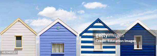 Panorama of colorful blue white Beach Huts at the Beach of Southwold, England.
