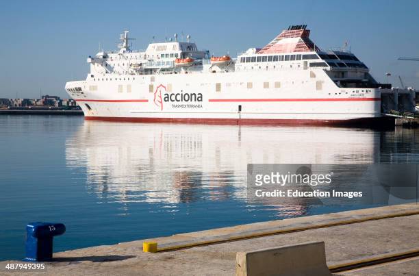 Juan J Sister Acciona Trasmediterranea shipping line Ro-Ro ferry ship moored in the port at Malaga, Spain.