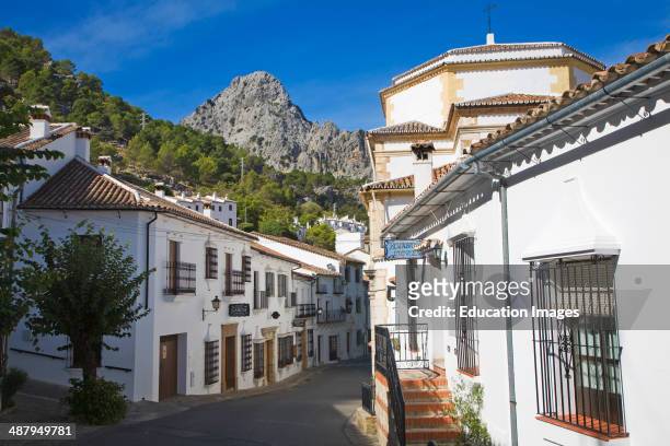 Limestone mountain peaks tower over the Village of Grazalema, Cadiz province, Spain.
