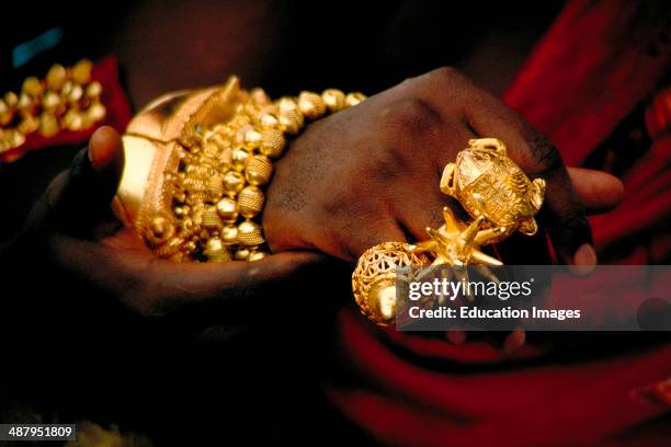 Close up of an Akan king's hand showing traditional Ashanti rings made of pure gold. Such displays of wealth are a common sight at Durbars,...