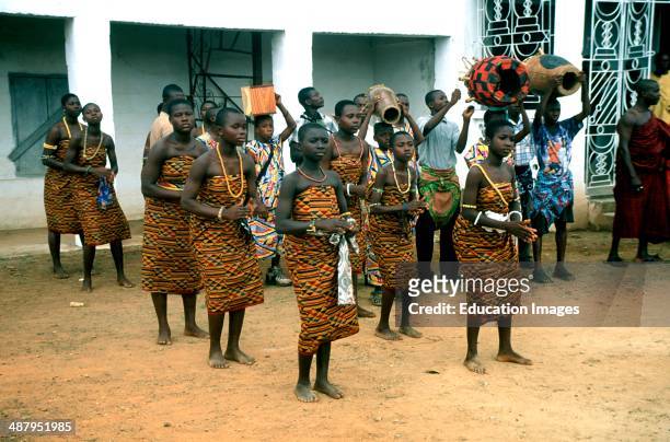 Young Ashanti girls wearing kente cloth dance for the king at a royal durbar in Kumasi in the Ashanti Region of Ghana, West Africa.