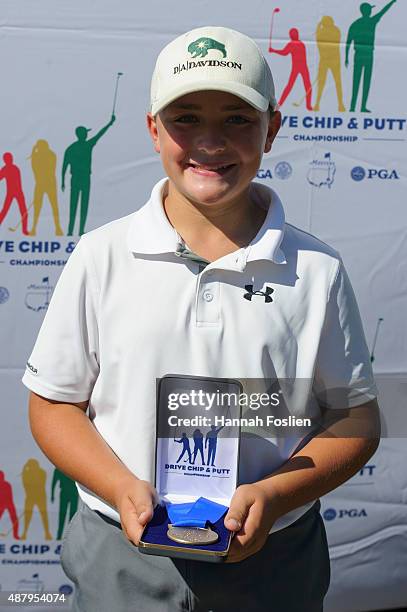 Luke Gutschewski poses for a photo after winning first place in chip at a Regional Finals for 12-13 year old boys at the Drive, Chip and Putt...