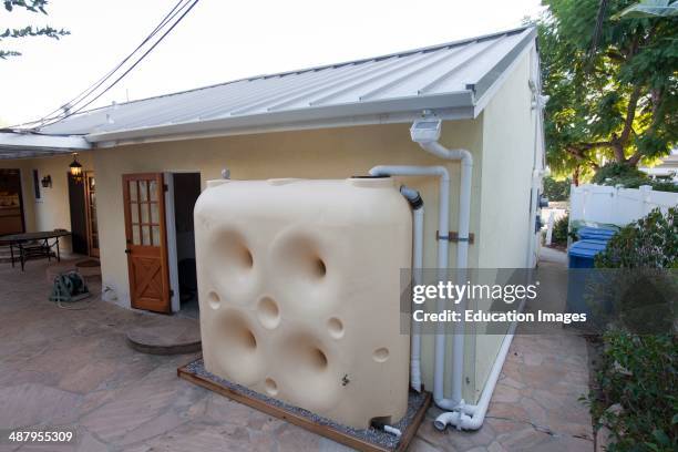 Fat Boy Water Wall, 650 Gallon Above Ground Cistern, collects rainwater from metal roof that facilitates runoff on Green home that is off the grid....