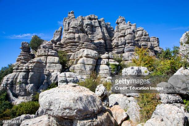 Dramatic limestone scenery of rocks shaped by erosion and weathering at El Torcal de Antequera national park, Andalusia, Spain.