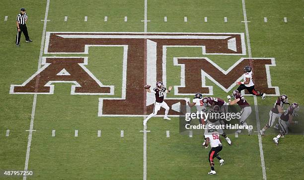 Kyle Allen of the Texas A&M Aggies drops back to pass in the first half of their game against the Ball State Cardinals at Kyle Field on September 12,...