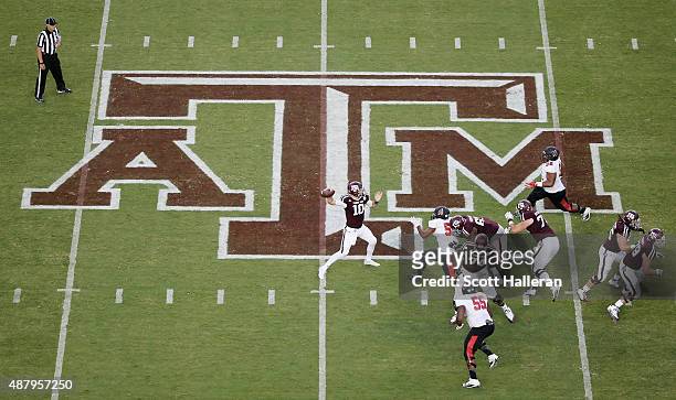 Kyle Allen of the Texas A&M Aggies drops back to pass in the first half of their game against the Ball State Cardinals at Kyle Field on September 12,...