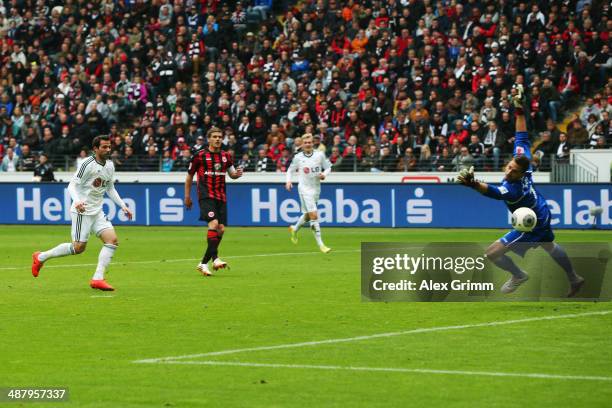 Gonzalo Castro of Leverkusen scores his team's first goal against goalkeeper Kevin Trapp of Frankfurt during the Bundesliga match between Eintracht...