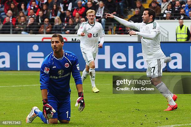 Gonzalo Castro of Leverkusen celebrates his team's first goal as goalkeeper Kevin Trapp of Frankfurt reacts during the Bundesliga match between...