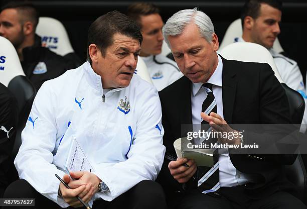 Alan Pardew manager of Newcastle United and assistant John Carver in discussion prior to during the Barclays Premier League match between Newcastle...