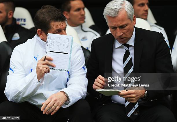 Alan Pardew manager of Newcastle United and assistant John Carver in discussion prior to during the Barclays Premier League match between Newcastle...