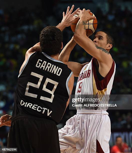 Argentina's small forward Patricio Garino marks Venezuela's point guard Heissler Guillent during their 2015 FIBA Americas Championship Men's Olympic...